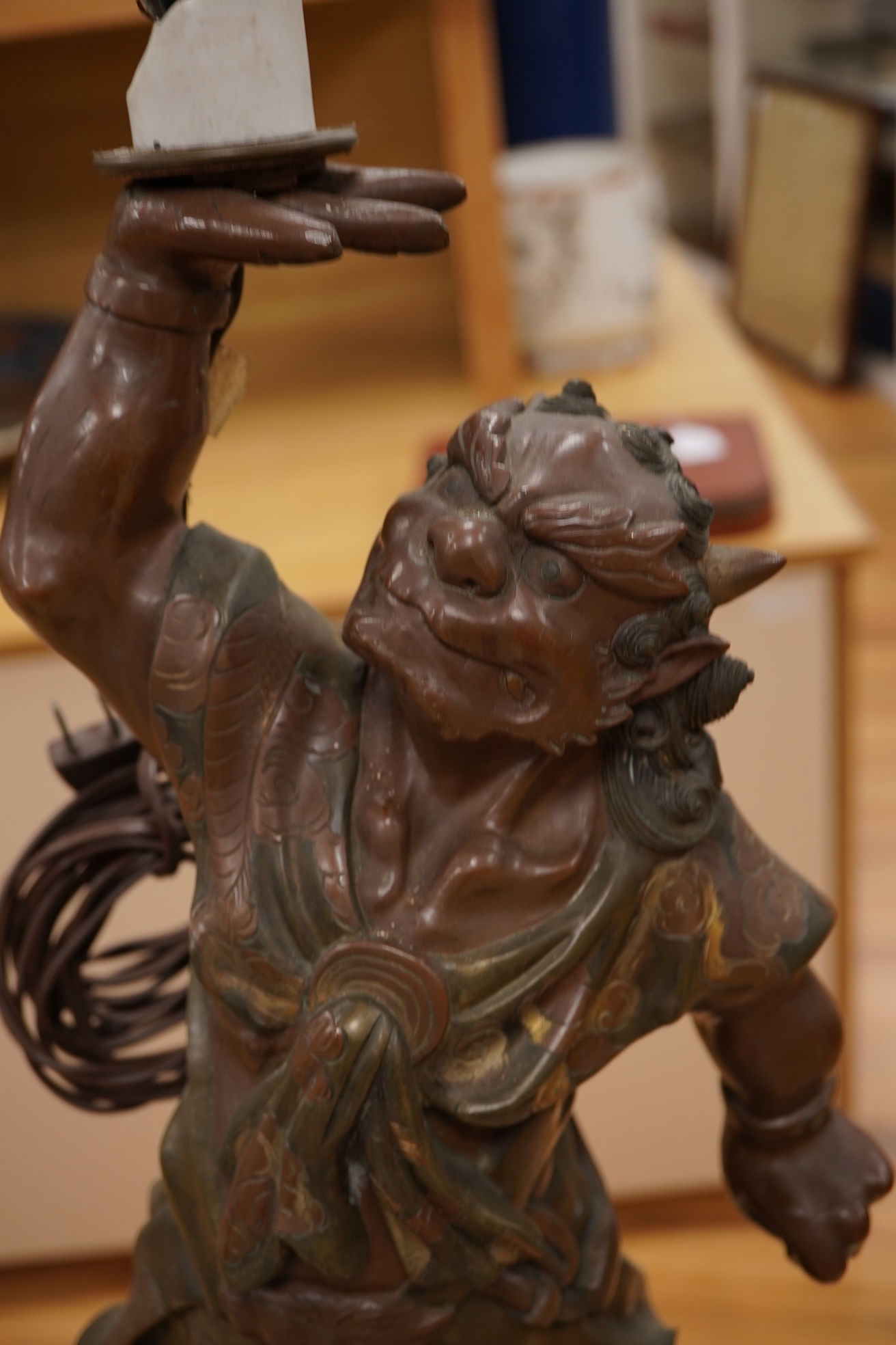 A Japanese bronze model of an oni, Meiji period, now mounted as a lamp, 50cm